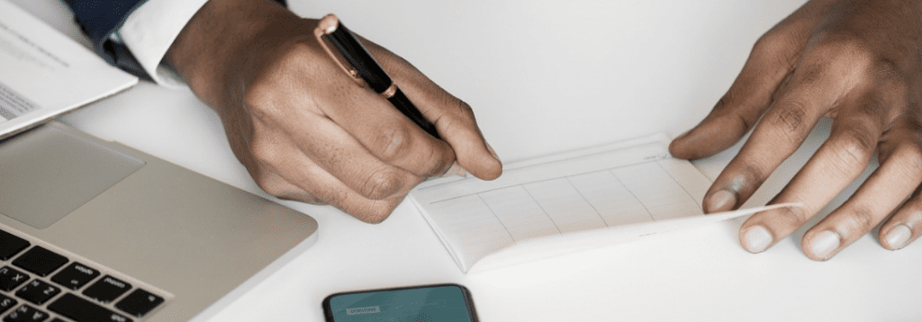 Man handwriting his duty payment