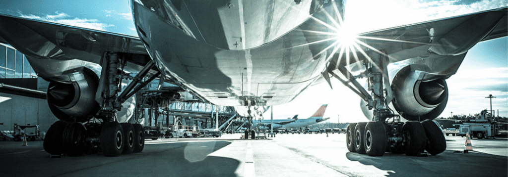 plane at an airport waiting to load cargo