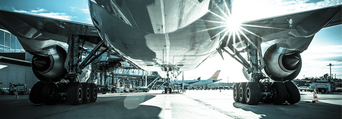 plane at an airport waiting to load cargo