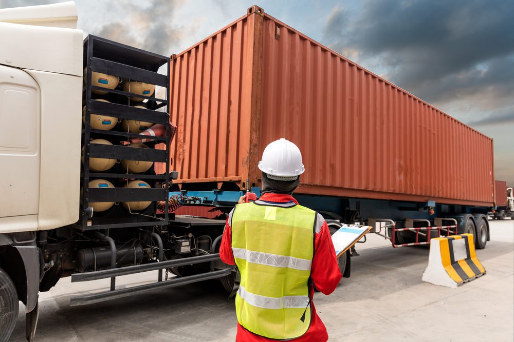 Photo of a Foreman Loading Containers