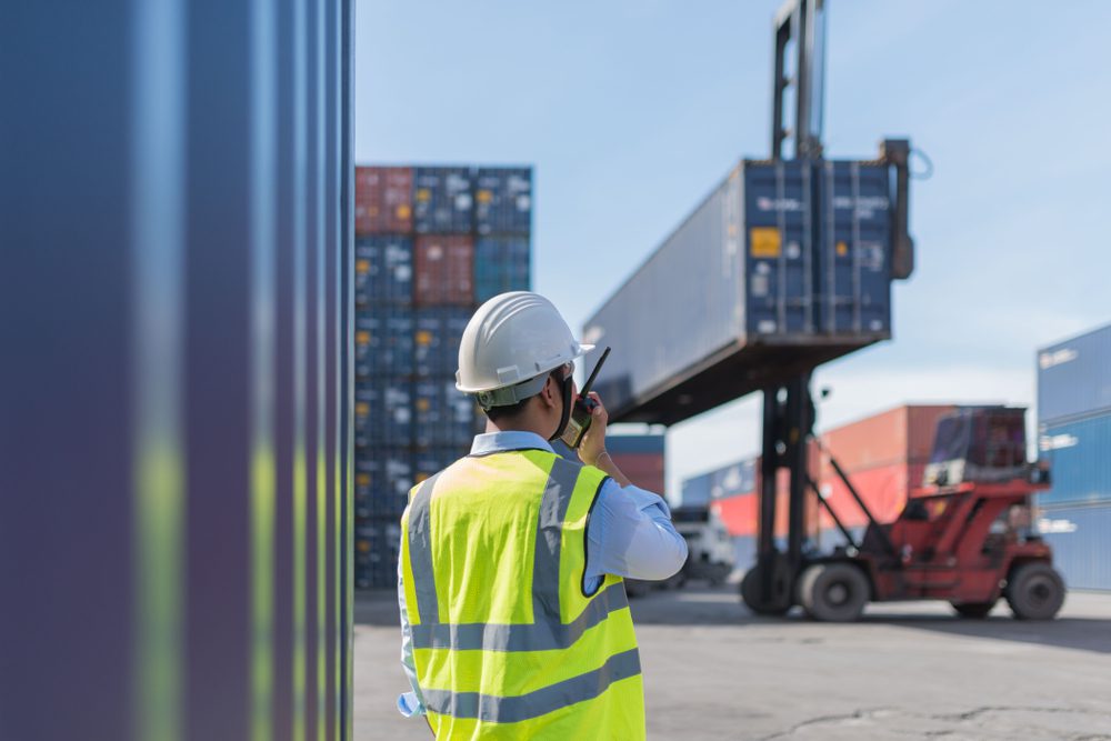 Photo of a Foreman Loading Cargo Contianers