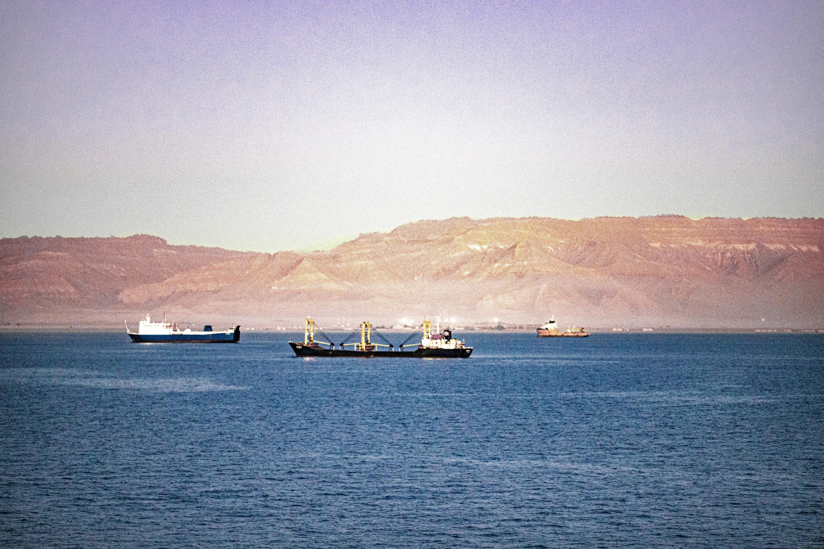 ocean freight container ships traveling through canal