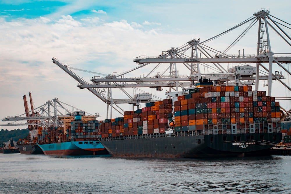 Two cargo ships by a port