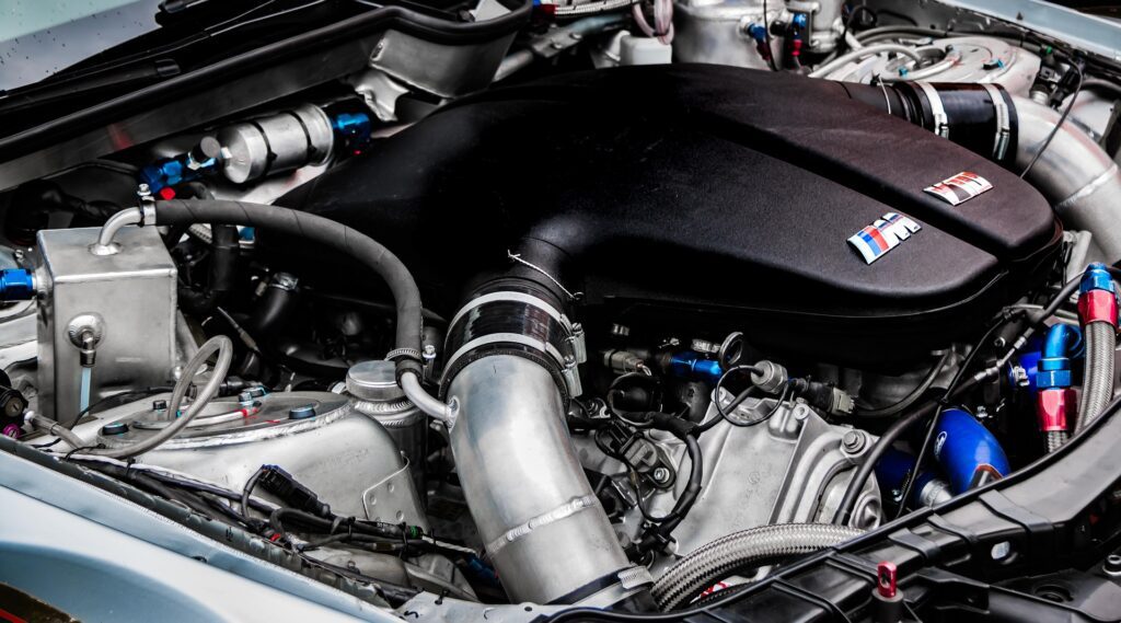 High-performance BMW M engine with aftermarket modifications.