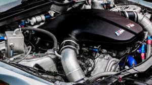 High-performance BMW M engine with aftermarket modifications.